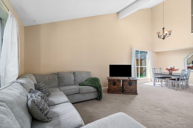 carpeted living room featuring an inviting chandelier and vaulted ceiling with beams