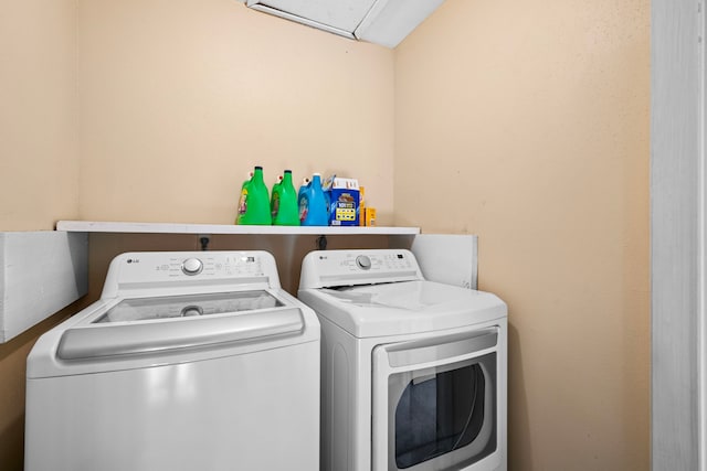 washroom featuring independent washer and dryer