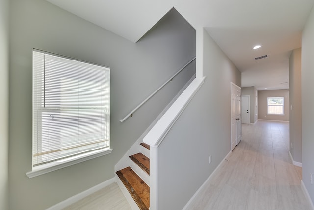 staircase featuring hardwood / wood-style flooring