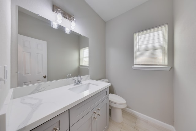 bathroom featuring vanity, toilet, and tile patterned floors