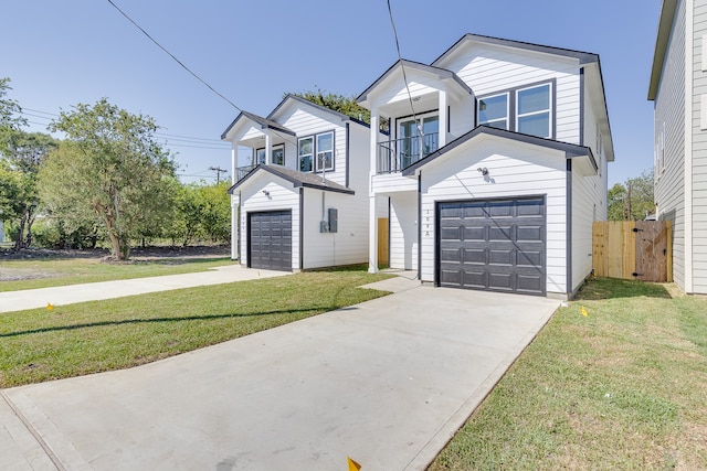 view of front facade with a garage, a balcony, and a front lawn