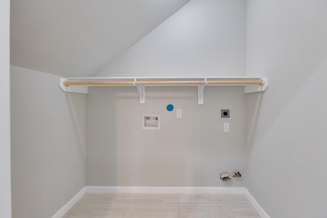 clothes washing area featuring washer hookup, gas dryer hookup, light tile patterned floors, and electric dryer hookup