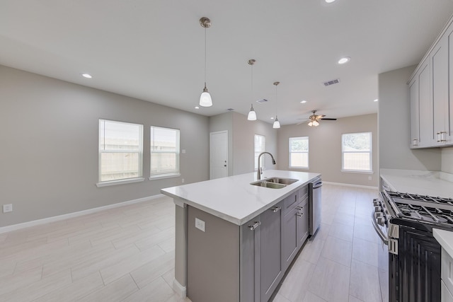 309A De Haven St, Houston, TX 77029 - kitchen with baseboards, gray cabinets, a ceiling fan, visible vents, and a sink