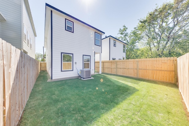 309A De Haven St, Houston, TX 77029 - back of house featuring a yard, a fenced backyard, and cooling unit