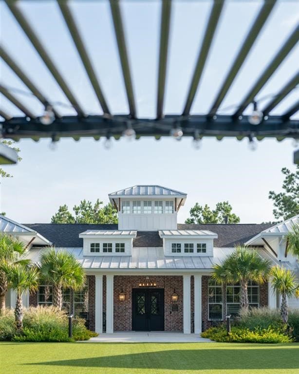 exterior space featuring french doors and a yard