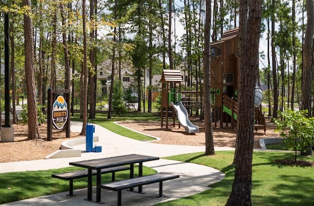 surrounding community featuring a lawn and a playground