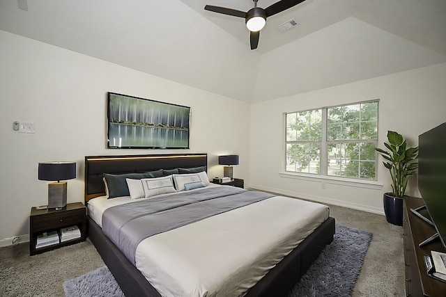 bedroom with dark colored carpet, ceiling fan, and vaulted ceiling