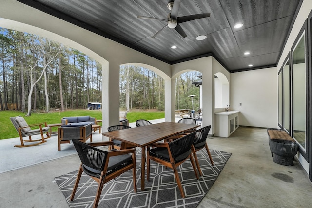 view of patio / terrace with an outdoor living space and ceiling fan