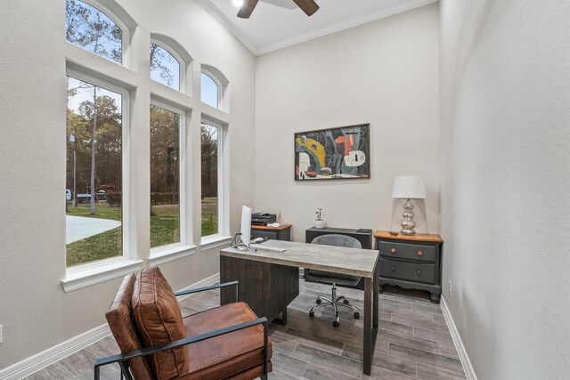 office space featuring wood-type flooring, ornamental molding, and ceiling fan