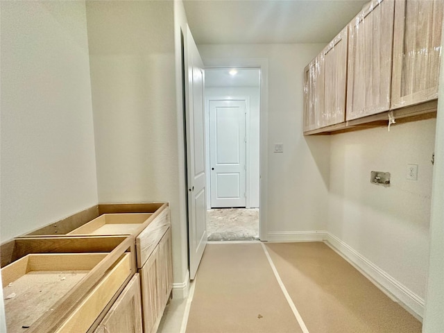 washroom featuring washer hookup and cabinets