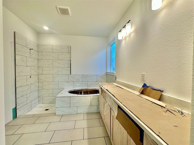 bathroom with tile patterned floors and separate shower and tub