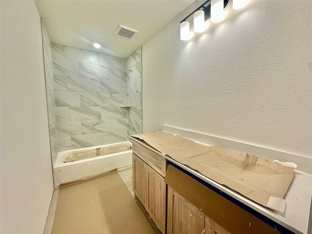 bathroom with a tile shower