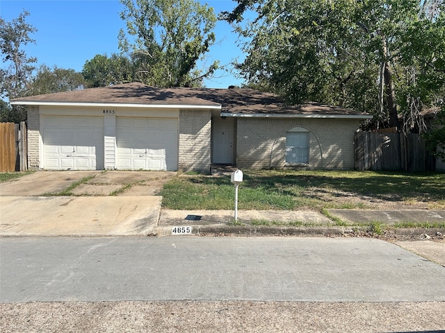 single story home with a garage