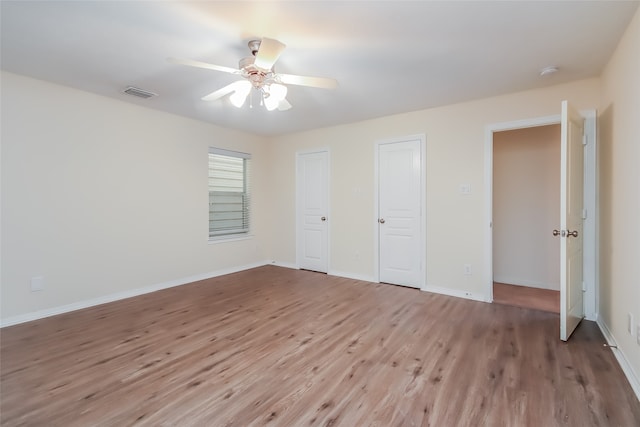 unfurnished bedroom featuring ceiling fan and light hardwood / wood-style flooring