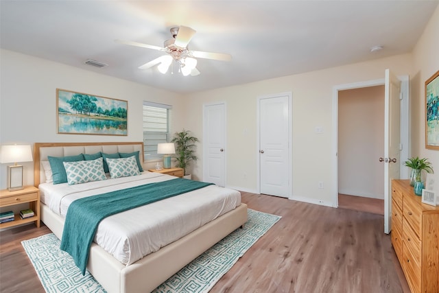 bedroom featuring wood-type flooring and ceiling fan