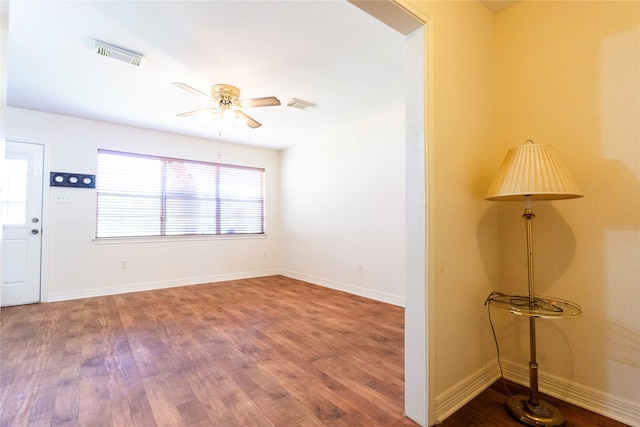 empty room featuring ceiling fan and hardwood / wood-style floors