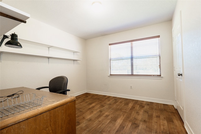 unfurnished office with dark hardwood / wood-style flooring