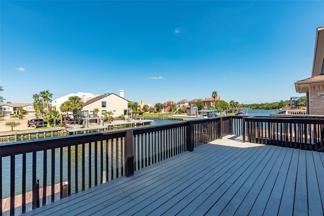 wooden deck featuring a water view