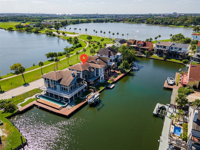 birds eye view of property featuring a water view