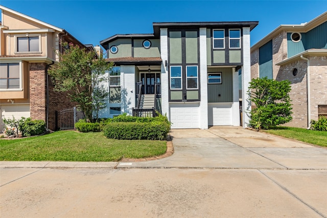 view of front of home with a garage and a front yard