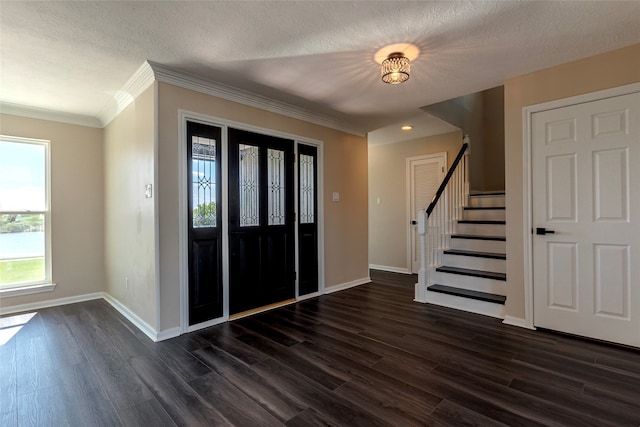 entryway featuring crown molding, dark wood-type flooring, and a textured ceiling