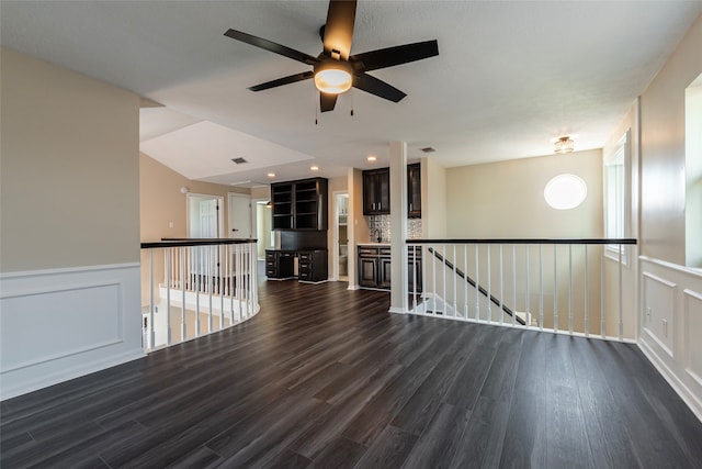 unfurnished room featuring ceiling fan and dark hardwood / wood-style flooring