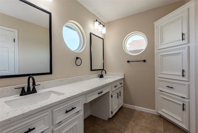 bathroom featuring vanity and tile patterned flooring