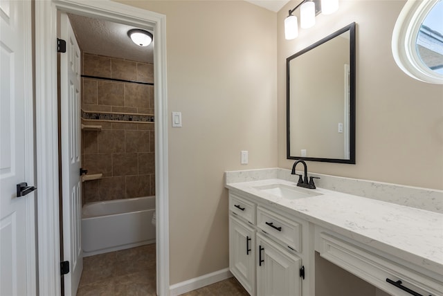 full bathroom featuring vanity, tiled shower / bath combo, tile patterned flooring, toilet, and a textured ceiling