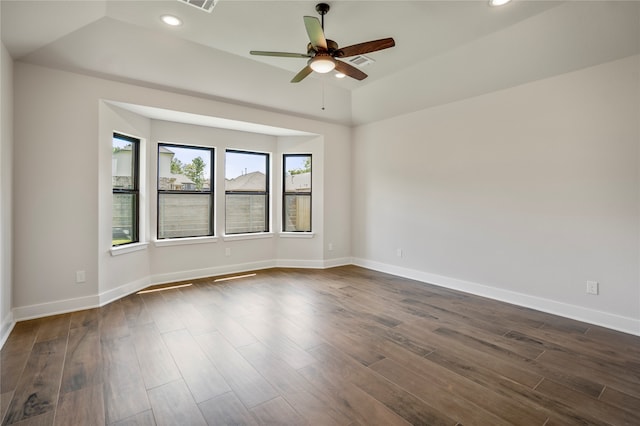 unfurnished room with ceiling fan and dark wood-type flooring