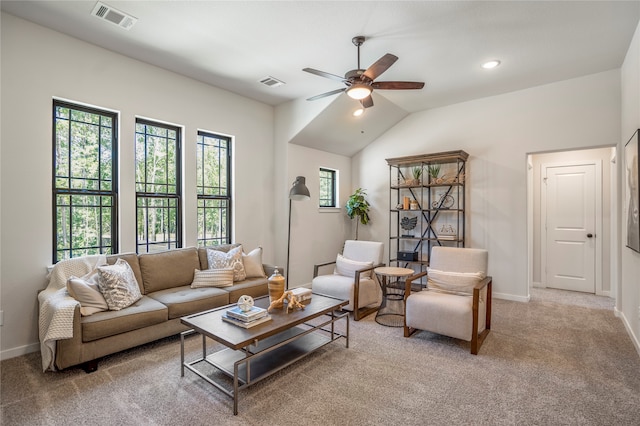 carpeted living room with lofted ceiling and ceiling fan