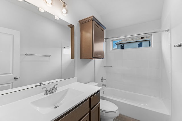 full bathroom featuring toilet, vanity, and tiled shower / bath