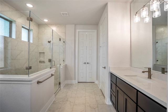 bathroom with vanity and an enclosed shower