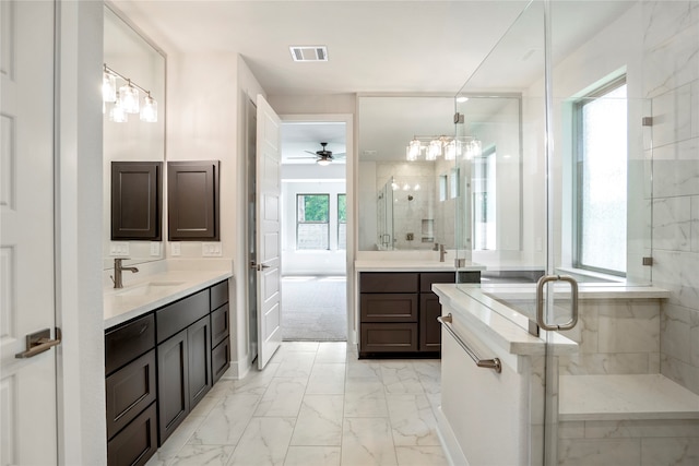 bathroom with a shower with shower door, vanity, and ceiling fan