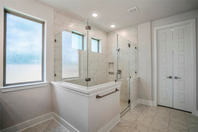 bathroom with a wealth of natural light and walk in shower