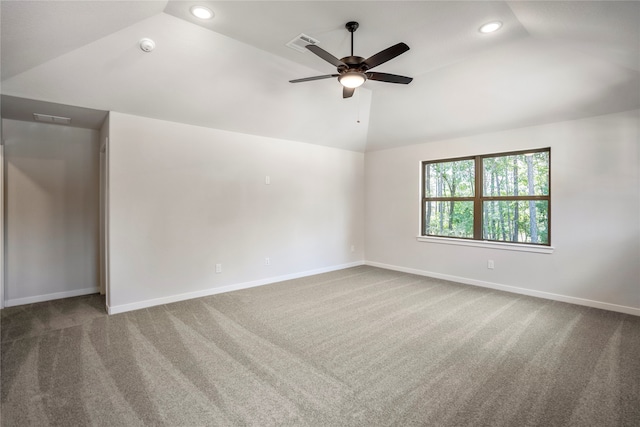 spare room with ceiling fan, carpet floors, and vaulted ceiling