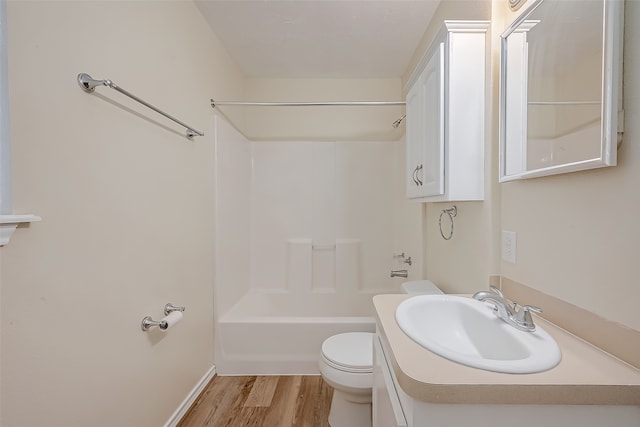 full bathroom featuring bathing tub / shower combination, vanity, toilet, and wood-type flooring