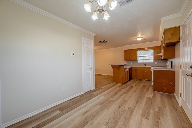 kitchen with an inviting chandelier, light hardwood / wood-style flooring, crown molding, and sink