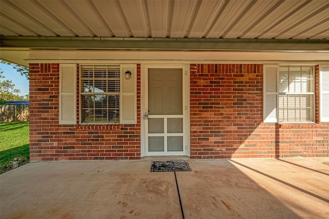 entrance to property with a patio