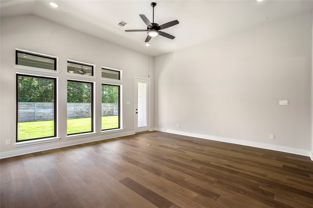 unfurnished room with ceiling fan, plenty of natural light, and dark wood-type flooring