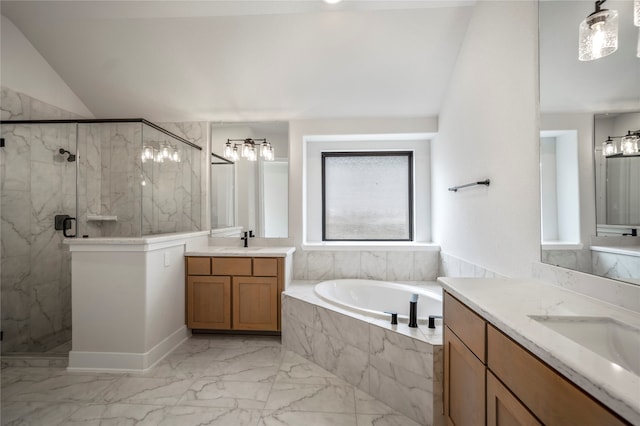 bathroom with vaulted ceiling, vanity, and separate shower and tub