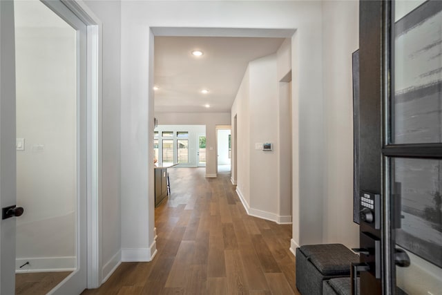 hallway featuring dark wood-type flooring