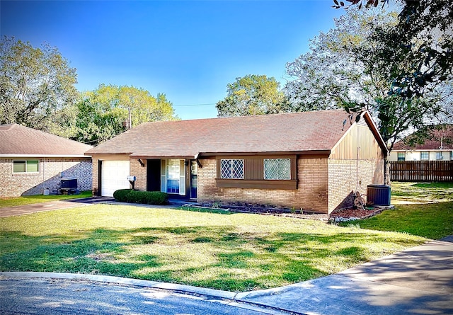 ranch-style home featuring a front yard and a garage