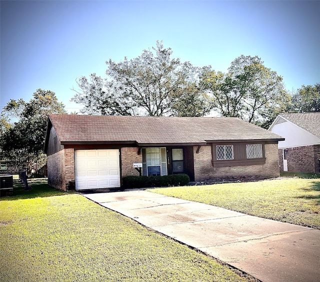 single story home with a garage and a front lawn