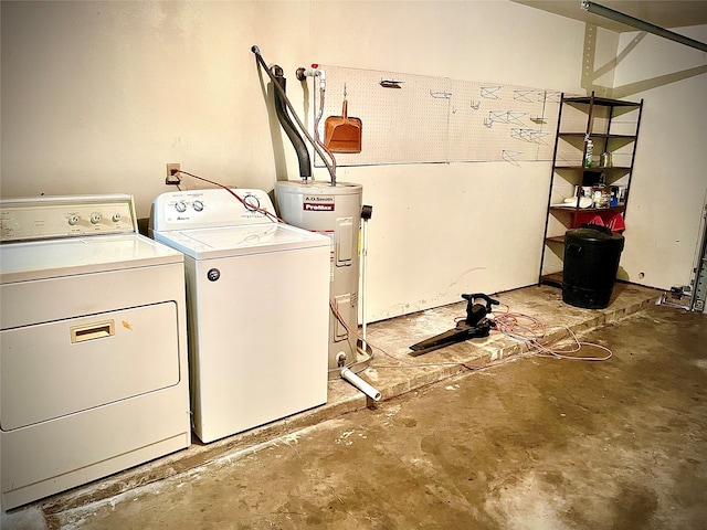 clothes washing area featuring washing machine and clothes dryer and water heater