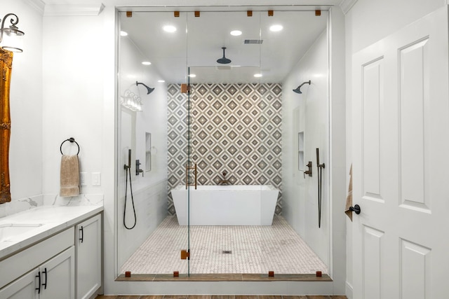 bathroom featuring crown molding, separate shower and tub, and vanity