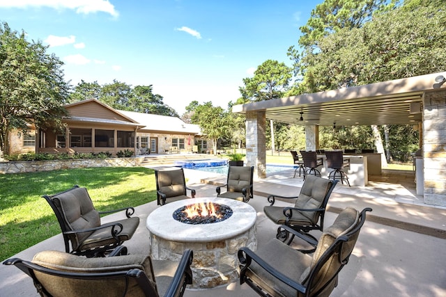 view of patio with an outdoor fire pit