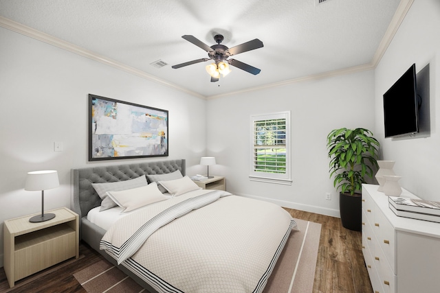 bedroom featuring ornamental molding, ceiling fan, dark wood-type flooring, and a textured ceiling