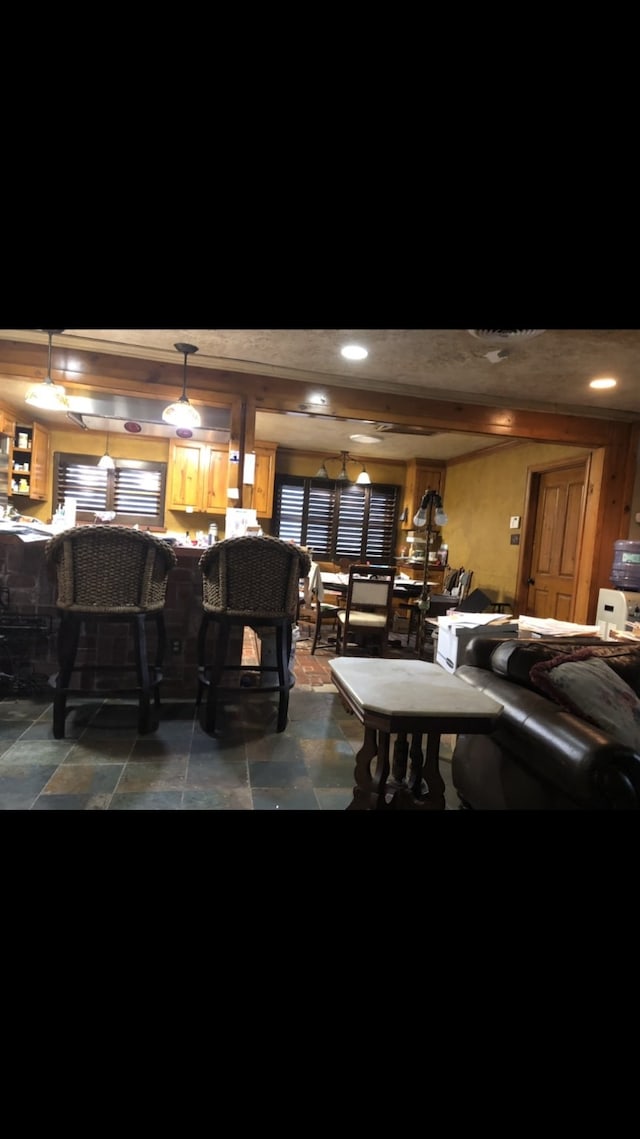 bar featuring hanging light fixtures