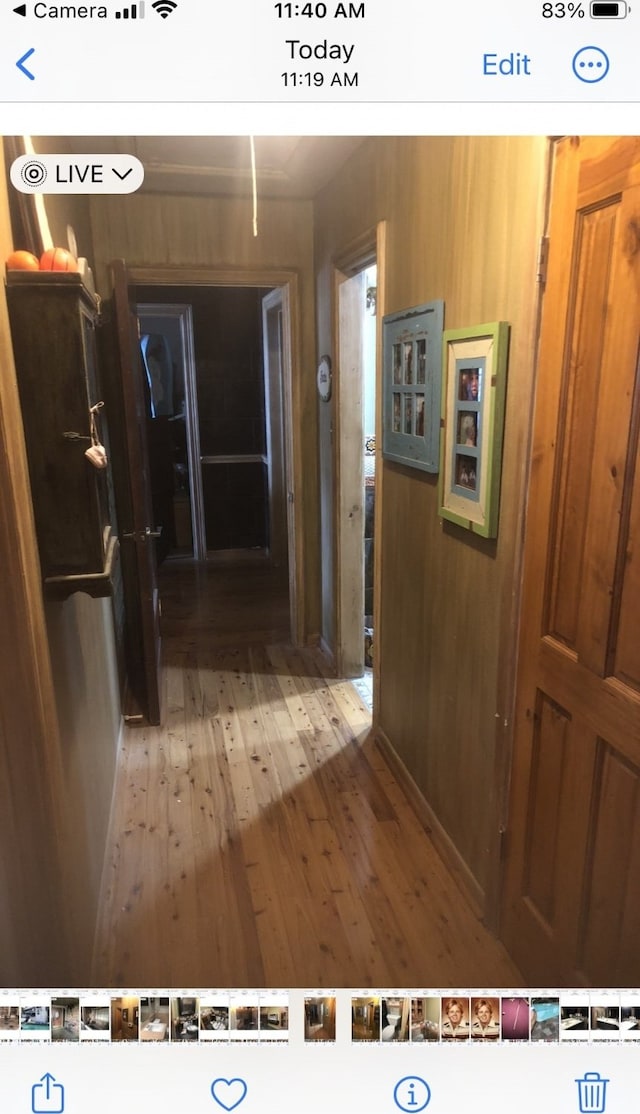 hall with hardwood / wood-style flooring