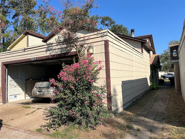 view of side of property with a garage